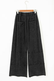 Mineral Wash Reverse Seam Drawstring Elastic Waist pants displayed on hanger, featuring cargo pockets and elastic waistband.