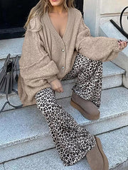 Buttoned Blouse styled with cozy oversized cardigan and trendy leopard print pants.
