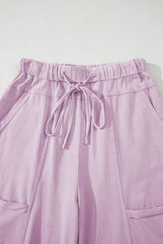 Mineral Wash Reverse Seam Drawstring Elastic Waist in soft lavender color with adjustable waistband and cargo pockets.