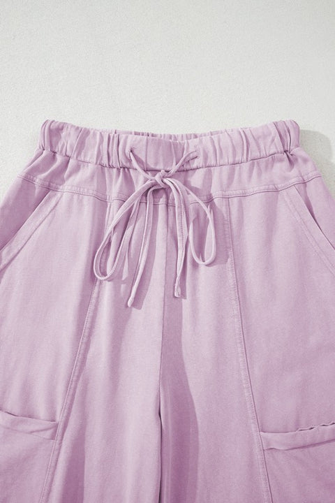 Mineral Wash Reverse Seam Drawstring Elastic Waist in soft lavender color with adjustable waistband and cargo pockets.