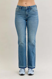 Judy Blue High-Waist Straight Leg Jeans – Tummy Control worn by a model, showcasing flattering silhouette and comfortable fit.