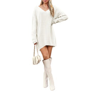 V-Neck Dropped Shoulder Sweater Dress – Cozy Knit Style worn with knee-high boots and a stylish purse.