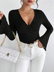 Ribbed Flare Sleeve Top in black featuring a deep v-neck and stylish ribbed design, worn with white jeans.