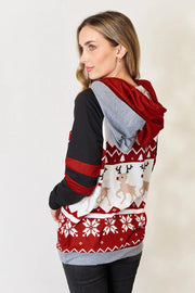 Double Take Christmas Hoodie featuring a festive design with reindeer and snowflakes, perfect for holiday gatherings.
