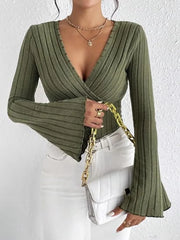 Ribbed Flare Sleeve Top in olive green with bell sleeves, paired with white jeans and a silver handbag.