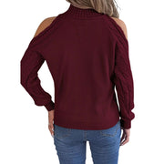 Back view of a woman wearing a Cable Knit Cold Shoulder Turtleneck Sweater in burgundy.
