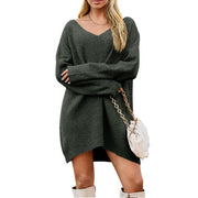 V-Neck Dropped Shoulder Sweater Dress – Cozy Knit Style worn with a stylish purse and knee-high boots.