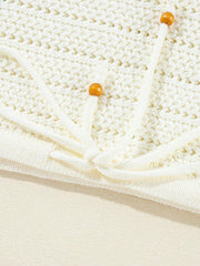 Boho Floral Cotton-Blend Eyelet Knit Sweater featuring delicate eyelet details and tie accents in white.