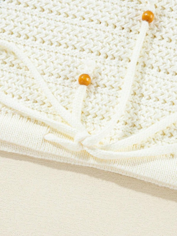 Boho Floral Cotton-Blend Eyelet Knit Sweater featuring delicate eyelet details and tie accents in white.