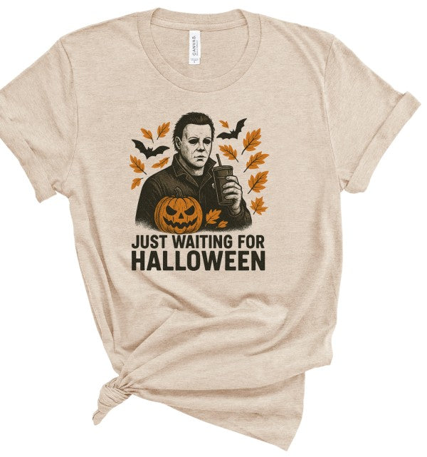 Just Waiting Halloween Graphic Tee featuring a spooky graphic on a soft cotton shirt, perfect for October.