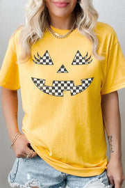 Checker Pumpkin Face Graphic Heavy Cotton Tee with playful pumpkin design on a yellow background