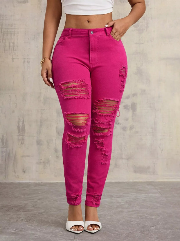 High-Waisted Distressed Skinny Jeans – Classic Denim Fit in vibrant pink with distressed detailing and a flattering fit.