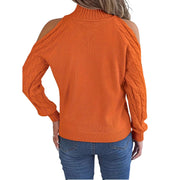Back view of a woman wearing a Cable Knit Cold Shoulder Turtleneck Sweater in vibrant orange with fashionable cutouts.