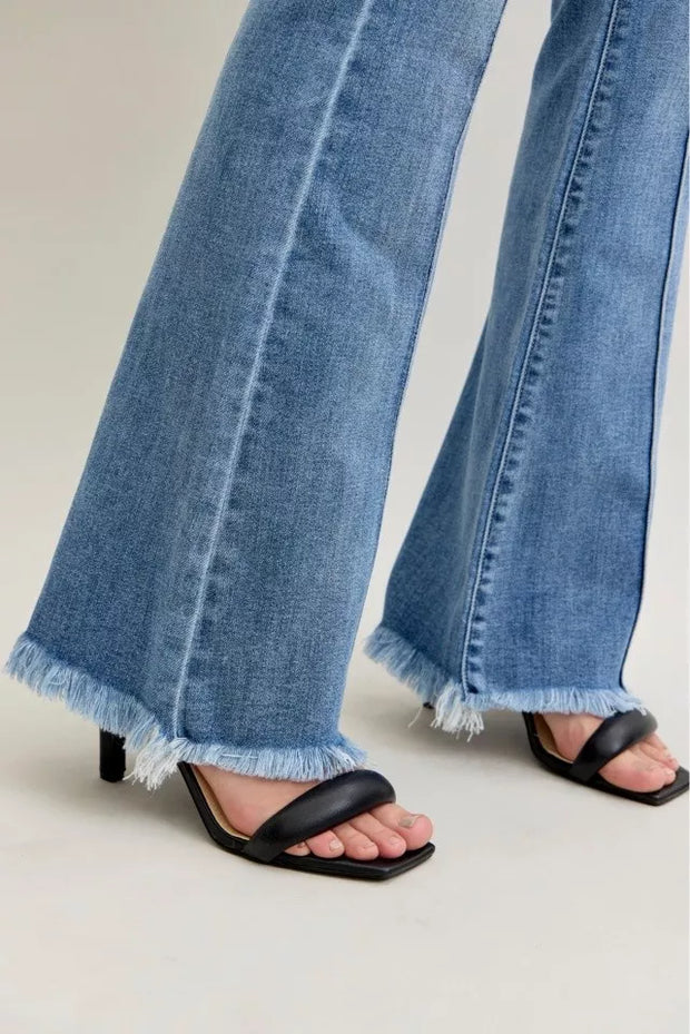 Judy Blue High Waist Flare Fray Hem Jeans with Pintuck Detail styled with black sandals.
