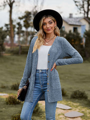 Ribbed Button-Up Cardigan with Pockets displayed outdoors, showcasing its casual style and cozy pockets.