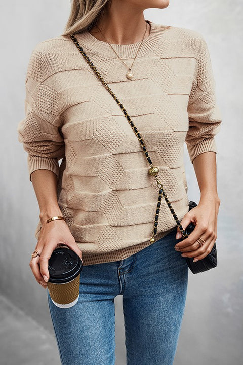 Classic Round Neck Loose Knit Sweater worn casually with coffee in hand, styled with jeans and a crossbody bag.