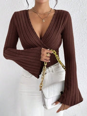 Ribbed Flare Sleeve Top – Slim Fit Knit in brown with flared sleeves and slim fit, styled with a white handbag.