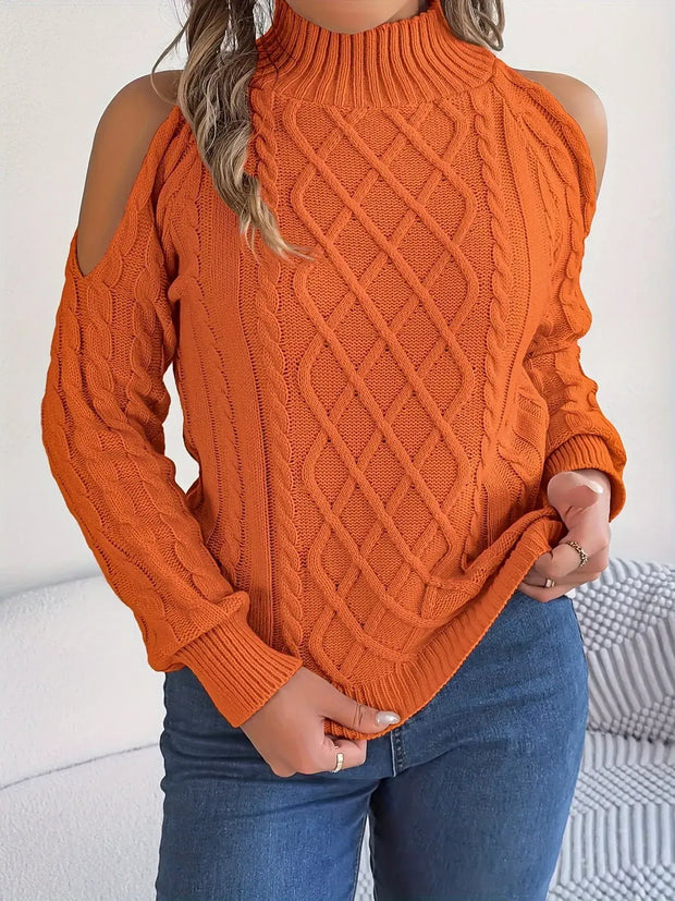 Model wearing a Cable Knit Cold Shoulder Turtleneck Sweater with stylish shoulder cutouts in vibrant orange.