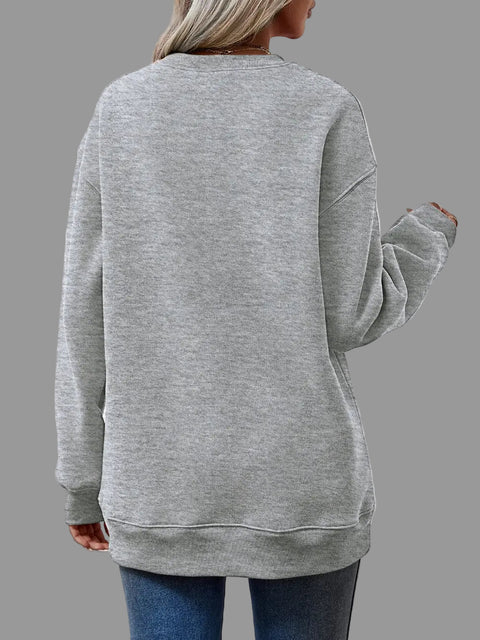 Back view of a model wearing a gray Letter Graphic Round Neck Sweatshirt with relaxed fit and long sleeves.
