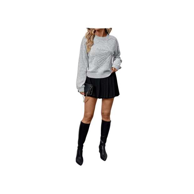 Embroidered Flower Bow Sweater with Rhinestone Detail – Round Neck Long Sleeve paired with a black pleated skirt.