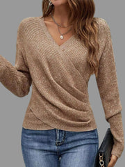Woman wearing a Surplice Long Sleeve Knit Top in a textured brown material, paired with blue jeans.