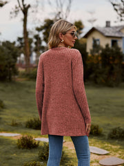 Ribbed Button-Up Cardigan with Pockets shown from the back in a casual outdoor setting.