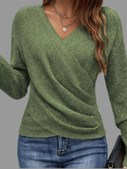 Woman wearing a Surplice Long Sleeve Knit Top in green with ribbed detailing and V-neck.
