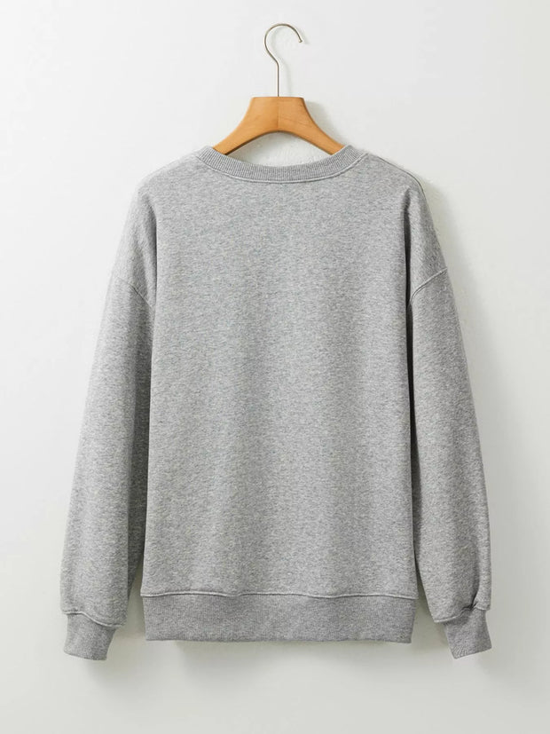 Back view of a cozy gray sweatshirt, perfect for layering with the Halloween Spooky Ghost Sequin Sweatshirt.