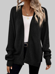 A model wearing a Supreme Comfort Open-Front Cardigan in black, showcasing its relaxed fit and stylish design.