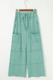 Mineral Wash Reverse Seam Drawstring Elastic Waist cargo pants with wide legs and functional pockets.