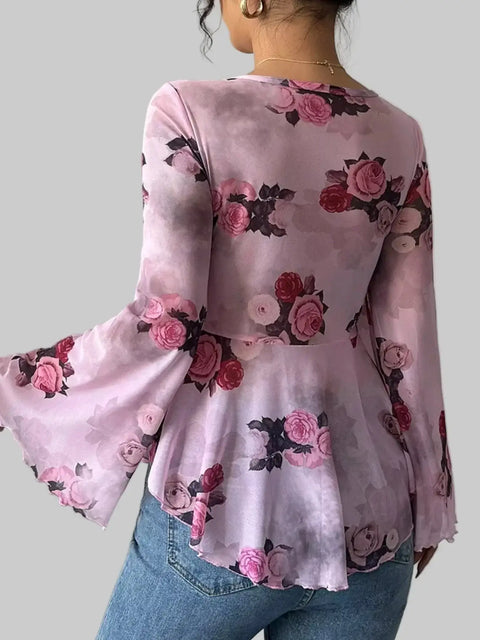 Back view of a Floral Tie-Front Blouse with flutter sleeves and rose print, perfect for a romantic and feminine look.