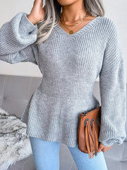 V-Neck Dropped Shoulder Sweater in gray, featuring ribbed texture and peplum style with relaxed fit and slightly stretchy material.