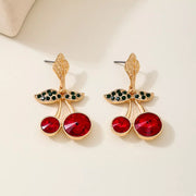 18K Gold-Plated Cherry Drop Earrings – Playful Statement Jewelry featuring vibrant red cherries and green leaf accents.