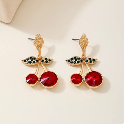 18K Gold-Plated Cherry Drop Earrings – Playful Statement Jewelry featuring vibrant red cherries and green leaf accents.