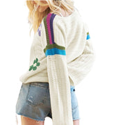 Boho Floral Cotton-Blend Eyelet Knit Sweater featuring eyelet knit details and relaxed fit with drop-shoulder sleeves.
