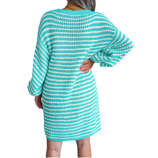 Striped Ribbed V-Neck Sweater Dress – Long Sleeve Knit in turquoise with white stripes on a model from the back.