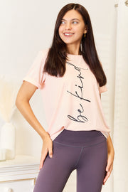 Simply Love Be Kind Graphic Tee featuring a minimalist 'be kind' design, styled with leggings for a chic and casual look.