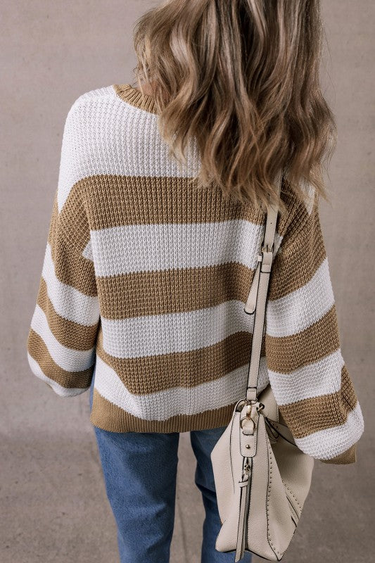 Arabella Striped Side-Slit Knit Sweater featuring bold color-block stripes and a relaxed drop-shoulder fit.