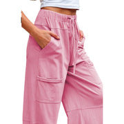 Mineral Wash Reverse Seam Drawstring Elastic Waist cargo pants with pockets in pink color.