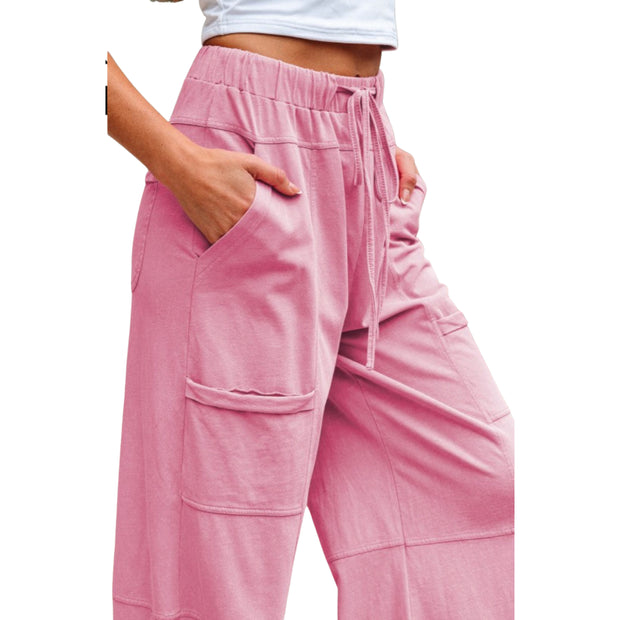 Mineral Wash Reverse Seam Drawstring Elastic Waist cargo pants with pockets in pink color.