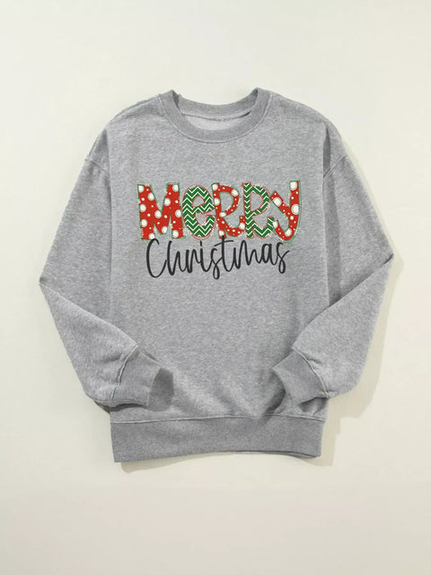 Flat lay of Merry Christmas Letter Sweatshirt showing bold holiday lettering and crewneck design on gray fleece fabric