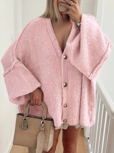 Buttoned Blouse in pink chunky knit, featuring a v-neck and oversized fit, perfect for stylish layering.