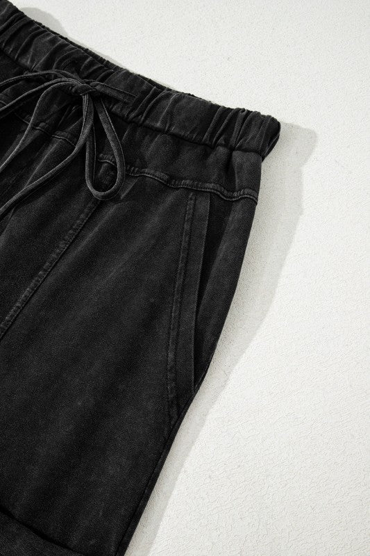 Mineral Wash Reverse Seam Drawstring Elastic Waist cargo pants with adjustable waistband and pockets.