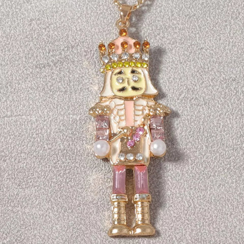 18K Gold Nutcracker Pendant Necklace featuring a colorful rhinestone-encrusted Nutcracker charm.