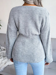 Back view of a V-Neck Dropped Shoulder Sweater in gray, featuring ribbed texture and peplum design.