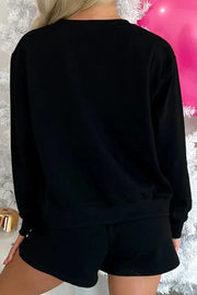 MERRY Sequin Lounge Set featuring a cozy black long-sleeve top and shorts, perfect for festive occasions.