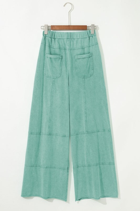 Mineral Wash Reverse Seam Drawstring Elastic Waist cargo pants in mint green with wide legs and cargo pockets.
