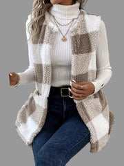 Woman wearing a Plaid Sherpa Vest Coat over a turtleneck, styled with jeans and layered accessories.