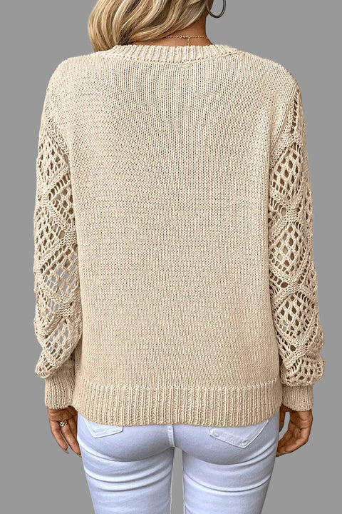 Back view of a V-Neck Crochet Sleeve Sweater featuring intricate crochet sleeves and a relaxed fit.