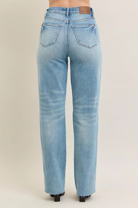 Back view of Judy Blue Plus Size High Waist Magic Star Destroy 90’s Straight Jeans showcasing the light blue wash and straight leg design.
